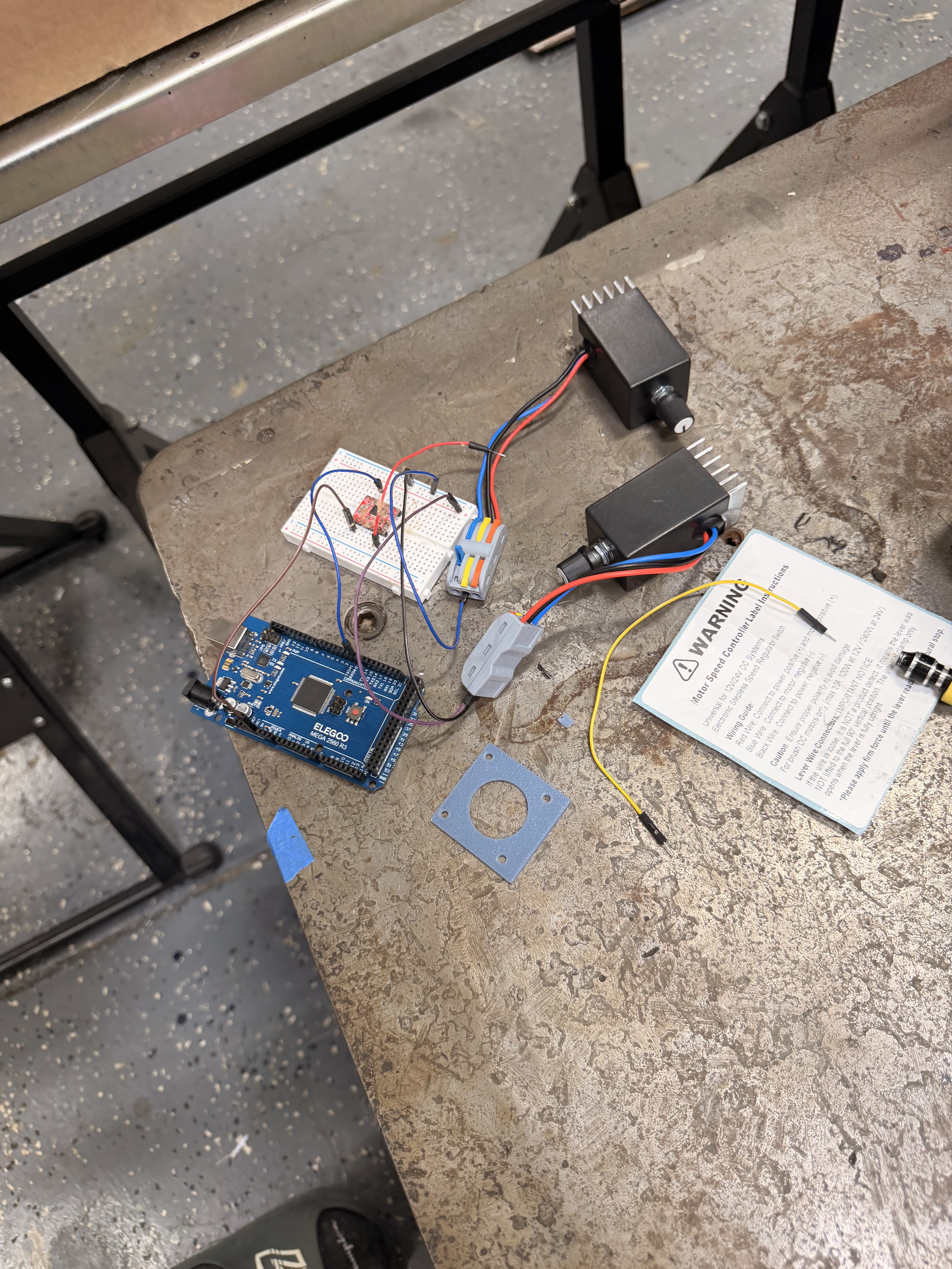 Elegoo Mega 2560 with two DC speed controllers and a red stepper driver